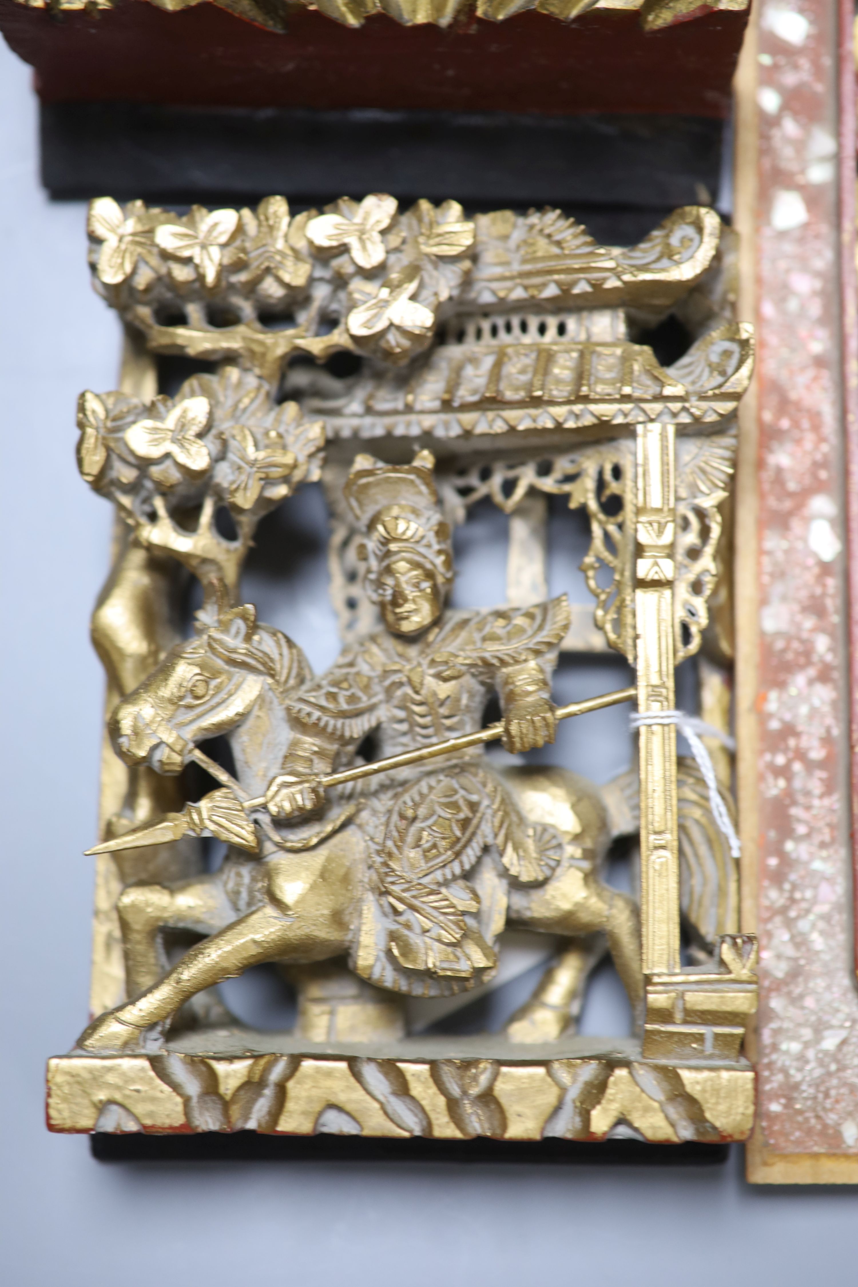 Five Chinese lacquer carved panels, longest 42cm
